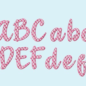 May include: Pink alphabet letters A through F in uppercase and lowercase with a polka dot pattern.