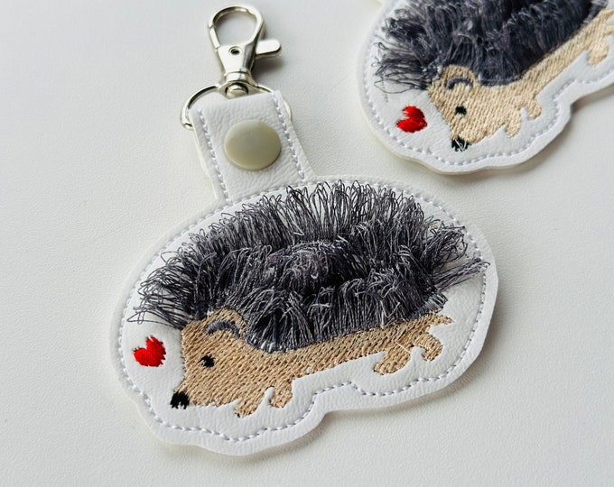 Fringed Hedgehog Eyelet and Key Fob Snap Tab in the hoop machine embroidery designs ITH project key ring fluffy fur animal kids backpack tag