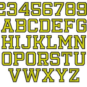 May include: A set of yellow uppercase letters and numbers with black outlines. The letters and numbers are in a bold, blocky font style.