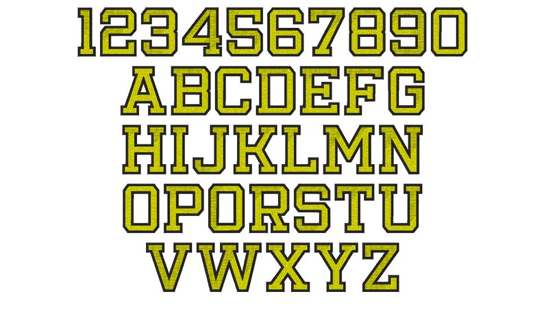 May include: A set of yellow uppercase letters and numbers with black outlines. The letters and numbers are in a bold, blocky font style.