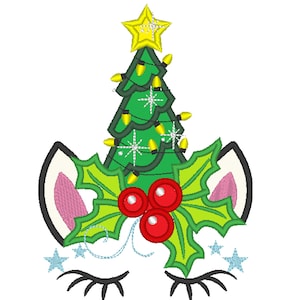 May include: A white unicorn face with closed eyes and eyelashes. The unicorn has a green Christmas tree with yellow lights and a gold star on top, and holly with red berries on the sides.