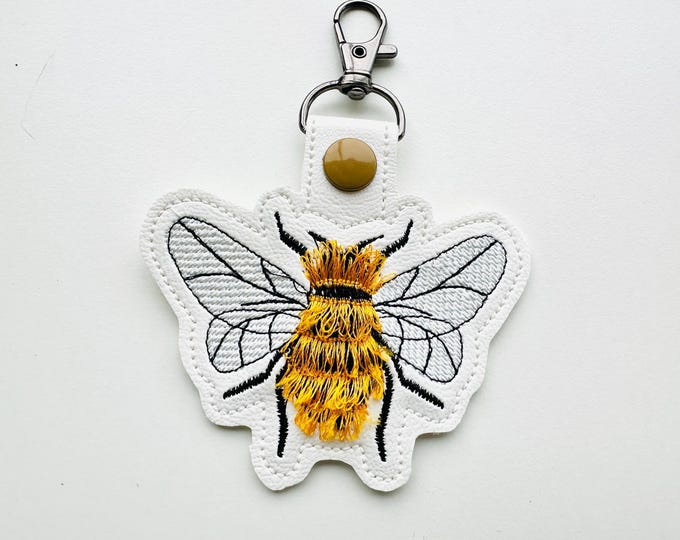 Fringed Fluffy Honey Bee Eyelet and Key Fob Snap Tab keychain in the hoop ITH machine embroidery designs bumble bee garden for hoop 4x4