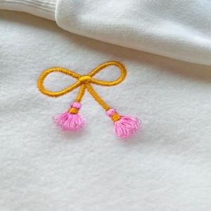 Fiocco con frange ricamo design nappe con frange pelliccia macchina ricamo design bambino bambini Fiocco in ciniglia con frange Monogramma ricamato con frange