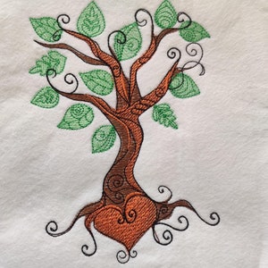 May include: Embroidered design of a stylized tree with green leaves and a brown trunk. The tree's roots form a heart shape.