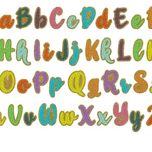 May include: A colorful alphabet with each letter outlined in gold glitter. The letters are in a variety of colors, including blue, green, red, orange, yellow, purple, and pink.