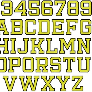 May include: A yellow alphabet and numbers with black outlines. The letters and numbers are in a bold, blocky font.