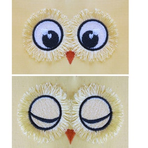 May include: Two embroidered eyes with yellow eyelashes and black pupils. The eyes are closed in the bottom image and open in the top image.