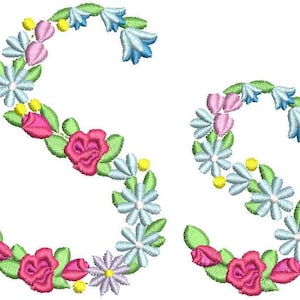 May include: Two embroidered capital letters "S" formed by a wreath of pink, blue and white flowers.