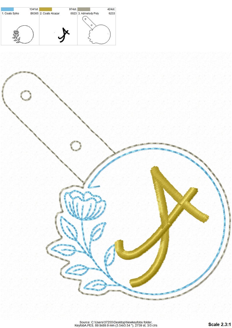 May include: A gold embroidered letter A with a blue flower design in a circle. The design is on a white fabric background.