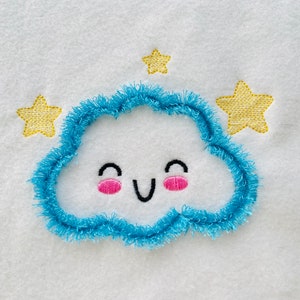 May include: A blue embroidered cloud with a smiling face and pink cheeks, surrounded by four yellow embroidered stars.