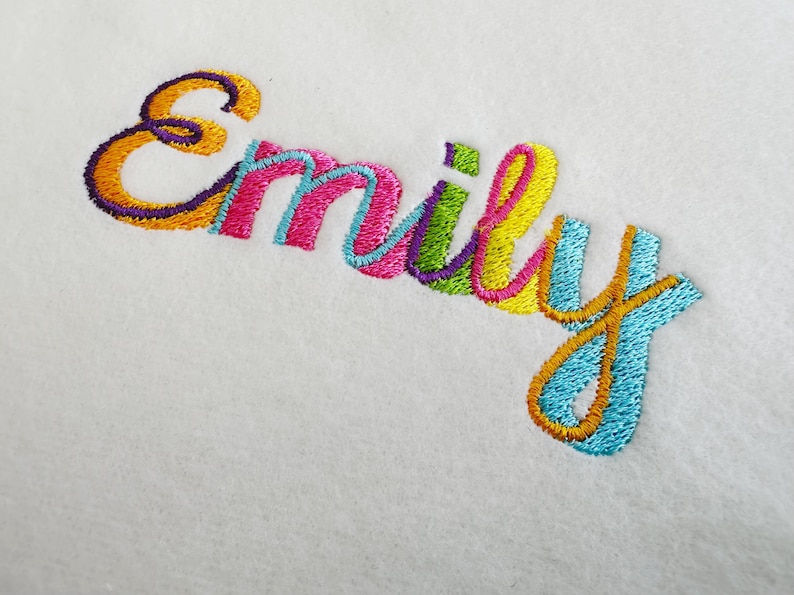 May include: Embroidered name "Emily" in a colorful rainbow font on a white background.
