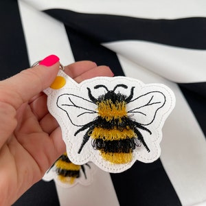 Bumblebee keychain embroidery in the hoop Bee embroidery project Fringed bees key fob snap tab machine embroidery designs ITH project keytab