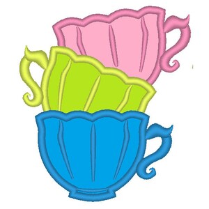 May include: Three teacups stacked on top of each other. The top cup is pink, the middle cup is green, and the bottom cup is blue.