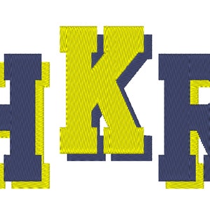 May include: A navy blue and yellow embroidered design of the letters "HKR".
