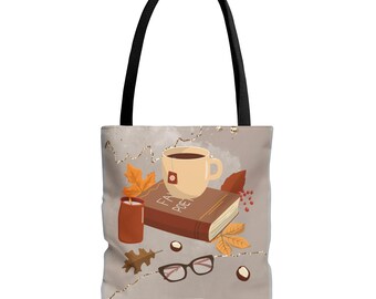 May include: Tote bag with a black handle and a beige background. The bag features a cozy autumn scene with a coffee cup, a book, fall leaves, a candle, and eyeglasses. The words "FAV POET" are on the book.