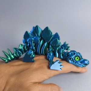 3D Printed Flexi Stegosaurus Skeleton: Articulated Dinosaur Toy with Glass Eyes