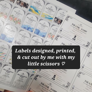 May include: A sheet of printed perfume labels with various designs and text, including "Overdose," "Strawberry Tears," and "Marshmallow Clouds." The labels are arranged on a white background. The image also includes "Thank You" cards.