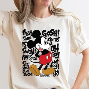 a woman wearing a mickey mouse t - shirt