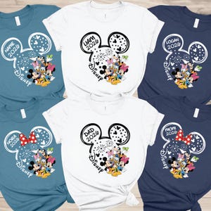 a collection of Disney-themed t-shirts, each featuring a different design and character from the Disney universe.