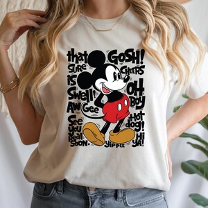 a woman wearing a mickey mouse t - shirt