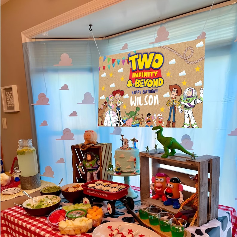 Cheerful Toy Story Birthday Wall Banner Mockup Banner on the Wall Food Buffet on the floor and birthday Décor, Clouds and flags Motifs featuring Toy Story Characters Perfect for Kids Party. Editable Canva Pdf.