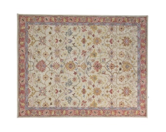 Ivory Floral Wool Rug: Hand Tufted with Red Border