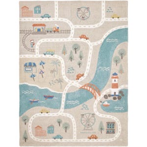 May include: A rectangular area rug featuring a beige background with a printed map design. The map includes white winding roads, a blue river, a lighthouse, a train, ferris wheels, trees, buildings, and various small cars.
