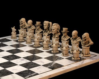 May include: A chess set with beige character busts on a black and white chequered board. The chess pieces are displayed on a marble-effect surface against a black backdrop. The chess pieces are inspired by comic book characters. The board's dimensions are in centimetres.