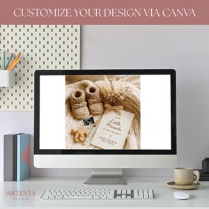 May include: A computer screen displays a baby announcement design. The design includes knitted baby booties, a sonogram, and a card that reads "Our Little Miracle Is On The Way." The text "CUSTOMIZE YOUR DESIGN VIA CANVA" is at the top.