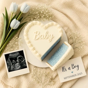 May include: A heart-shaped cake with blue filling and white frosting, decorated with the word "Baby". A slice is cut out. Includes a sonogram and a card that says "It's a Boy" and "September 2025". White tulips and baby's breath complete the scene.