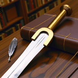 May include: A sword with a gold hilt and a silver blade lies on a brown leather-bound book. A silver feather quill is also present. The image suggests a historical or literary theme, with a focus on detail.