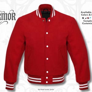 Puede incluir: Una chaqueta universitaria roja con ribetes acanalados a rayas blancas en el cuello, los puños y el dobladillo. La chaqueta cuenta con botones a presión blancos en la parte delantera. El texto incluye NURMOR, Available in All Colors & Sizes.