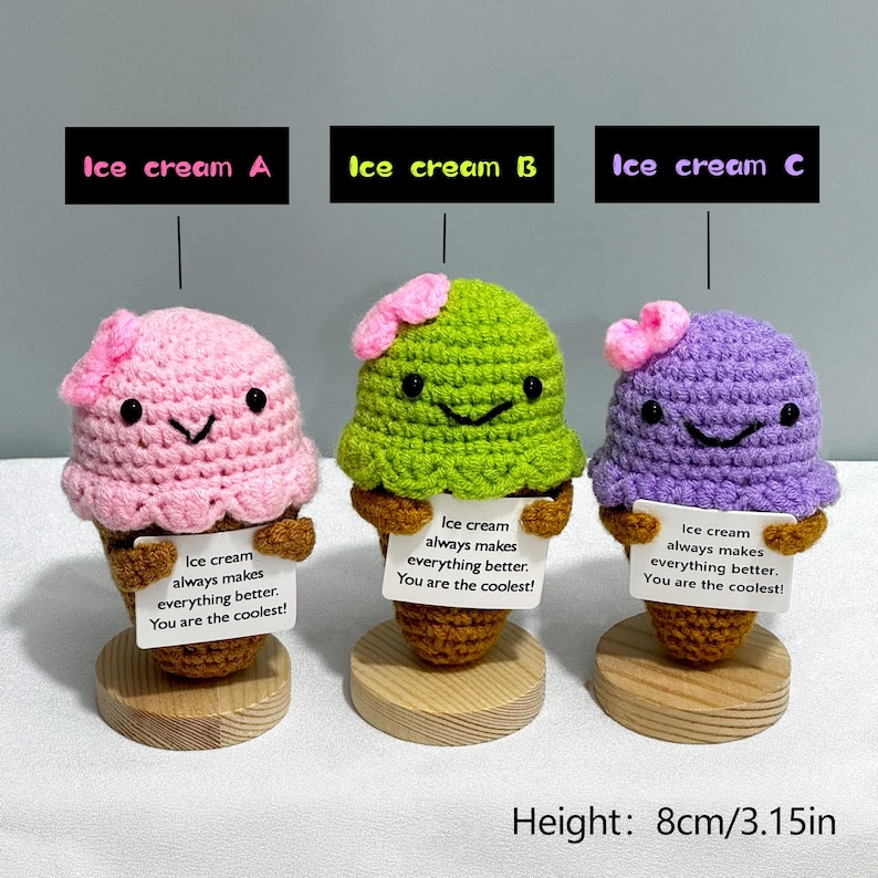 May include: Three crocheted ice cream cone figurines in pink, green, and purple. Each has a smiling face, a small flower, and a sign that reads "Ice cream always makes everything better. You are the coolest!" The height is 3.15 inches.