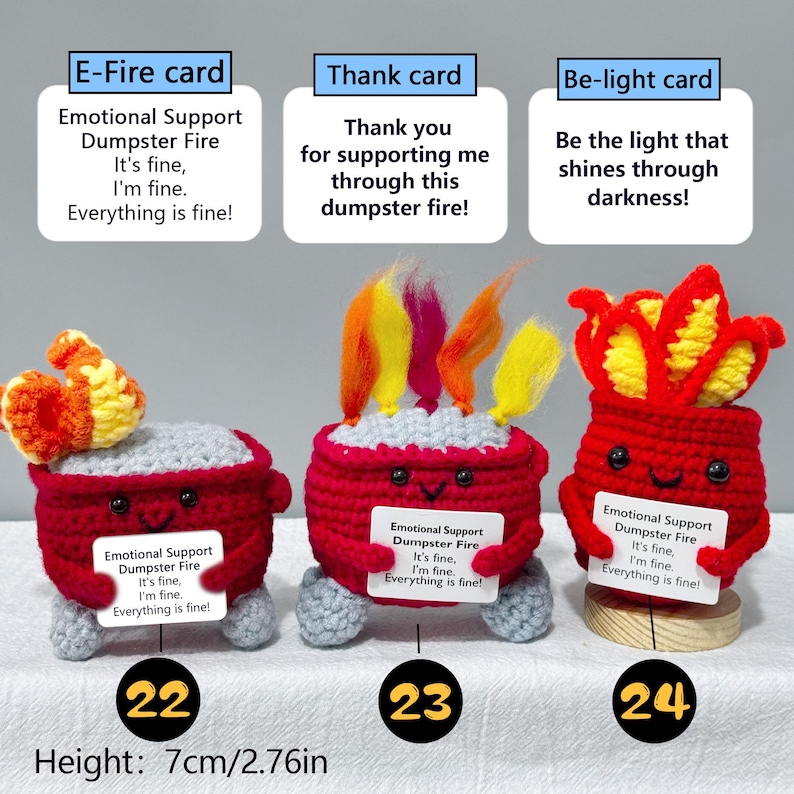 May include: Three handmade crochet figures, each a red dumpster with flames, holding cards with text. The figures are numbered 22, 23, and 24. Height is 2.76 inches (7 cm). The cards read "Emotional Support Dumpster Fire."