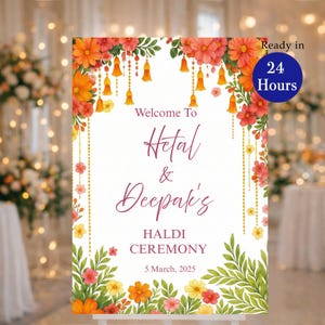 May include: A white sign with floral decorations and text. The sign reads "Welcome To Hetal & Deepak's HALDI CEREMONY 5 March, 2025." Orange, red, and yellow flowers and green leaves adorn the edges. A blue circle indicates the sign is ready in 24 hours.