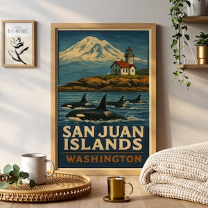 May include: Framed art print featuring a vintage travel poster design. The poster depicts orcas swimming in the ocean with a lighthouse and mountain in the background. Text reads "San Juan Islands Washington."