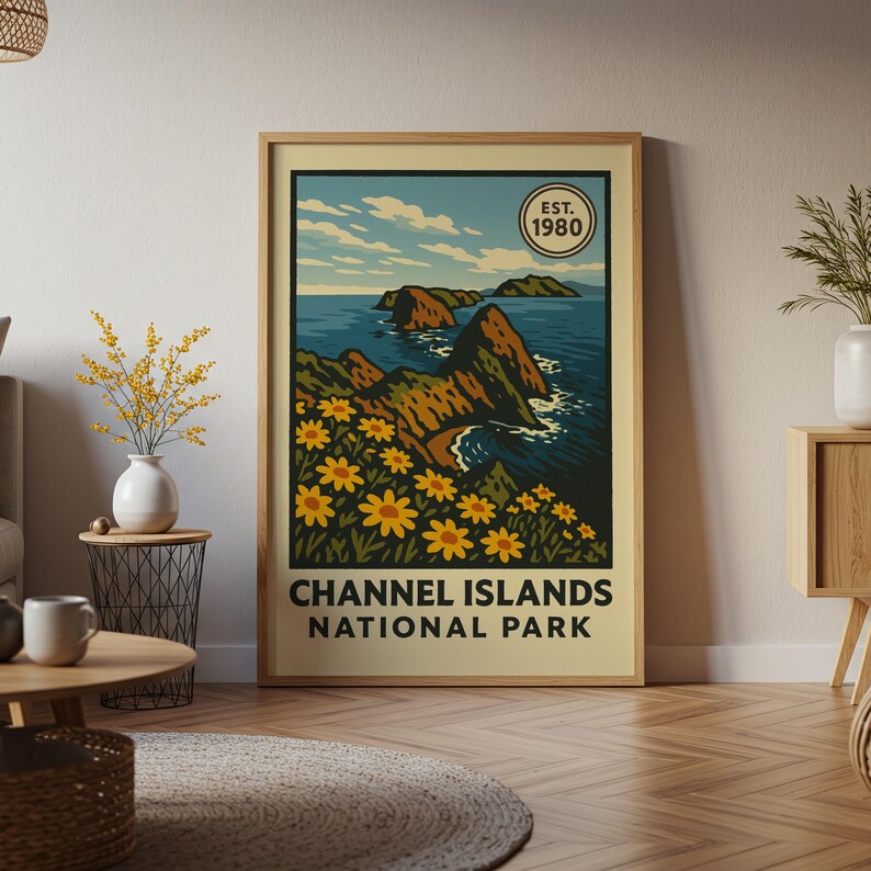 May include: A framed poster with a vintage illustration of the Channel Islands National Park. The artwork shows a coastal scene with rocky islands, blue sea, and yellow flowers. The text "Channel Islands National Park" is at the bottom, with "Est. 1980" in a circle.