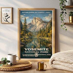 May include: A framed Yosemite National Park poster with a vintage design. The poster features a scenic landscape with a mountain, lake, and trees. The text "YOSEMITE NATIONAL PARK" and "ESTABLISHED OCTOBER 1, 1890" are visible. A smaller framed art piece is on the wall.