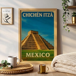 May include: A framed travel poster featuring Chichén Itzá, Mexico, with a blue sky backdrop. The poster has a wooden frame and the words "CHICHÉN ITZÁ" and "MEXICO" in a vintage font. A smaller framed art print and decorative items are also visible.