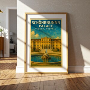 May include: Framed print of Sch&ouml;nbrunn Palace in Vienna, Austria. The artwork features a yellow palace with a blue sky and a fountain in the foreground. The text "SCH&Ouml;NBRUNN PALACE VIENNA, AUSTRIA" is displayed at the top of the print.
