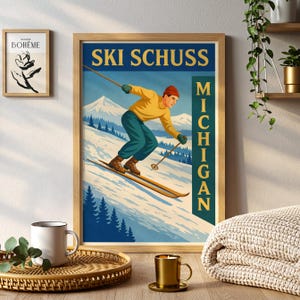 May include: A framed vintage-style poster with the text "SKI SCHUSS MICHIGAN" depicts a skier in yellow and teal attire skiing down a snowy mountain. The poster is in a wooden frame, with a smaller framed artwork to the left.