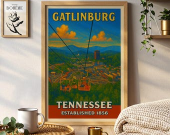 May include: A framed vintage travel poster for Gatlinburg, Tennessee, featuring a scenic view of the city with cable cars. The poster has a blue sky with orange clouds and the text "GATLINBURG TENNESSEE ESTABLISHED 1856".