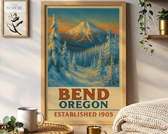 May include: A framed vintage travel poster for Bend, Oregon, featuring a snow-covered mountain and evergreen trees under a sunset sky. The poster reads "BEND OREGON ESTABLISHED 1905" in orange and green text. A smaller framed art print is visible to the left.