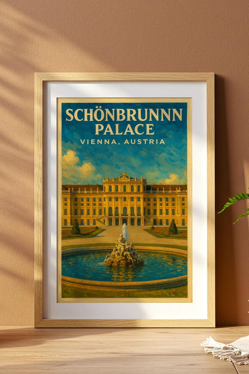 May include: Framed print of Sch&ouml;nbrunn Palace in Vienna, Austria. The artwork depicts the yellow palace with a fountain in front, set against a blue sky. The text "SCH&Ouml;NBRUNN PALACE VIENNA, AUSTRIA" is at the top.
