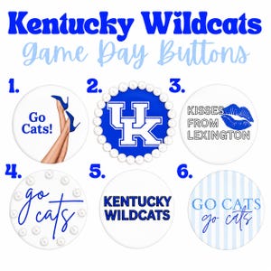 May include: Six circular buttons featuring Kentucky Wildcats themes. Button 1 shows legs in blue heels and 'Go Cats!'. Button 2 has a UK logo with a pearl border. Button 3 says 'Kisses from Lexington' with blue lips. Button 4 says 'go cats' with pearls. Button 5 says 'Kentucky Wildcats'. Button 6 has 'Go Cats' on blue stripes.