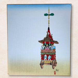 May include: A vibrant illustration of a Japanese festival float. The red float features gold detailing, figures, and a tall, decorated spire. The background fades from blue to yellow.