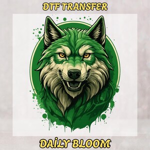May include: A digitally illustrated wolf head with green and white fur, set against a green circle and splatter effect. The text "DTF TRANSFER" is at the top, and "DAILY BLOOM" is at the bottom.