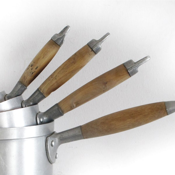 set of 4 French antique metal sauce pans, wooden handle, light patina