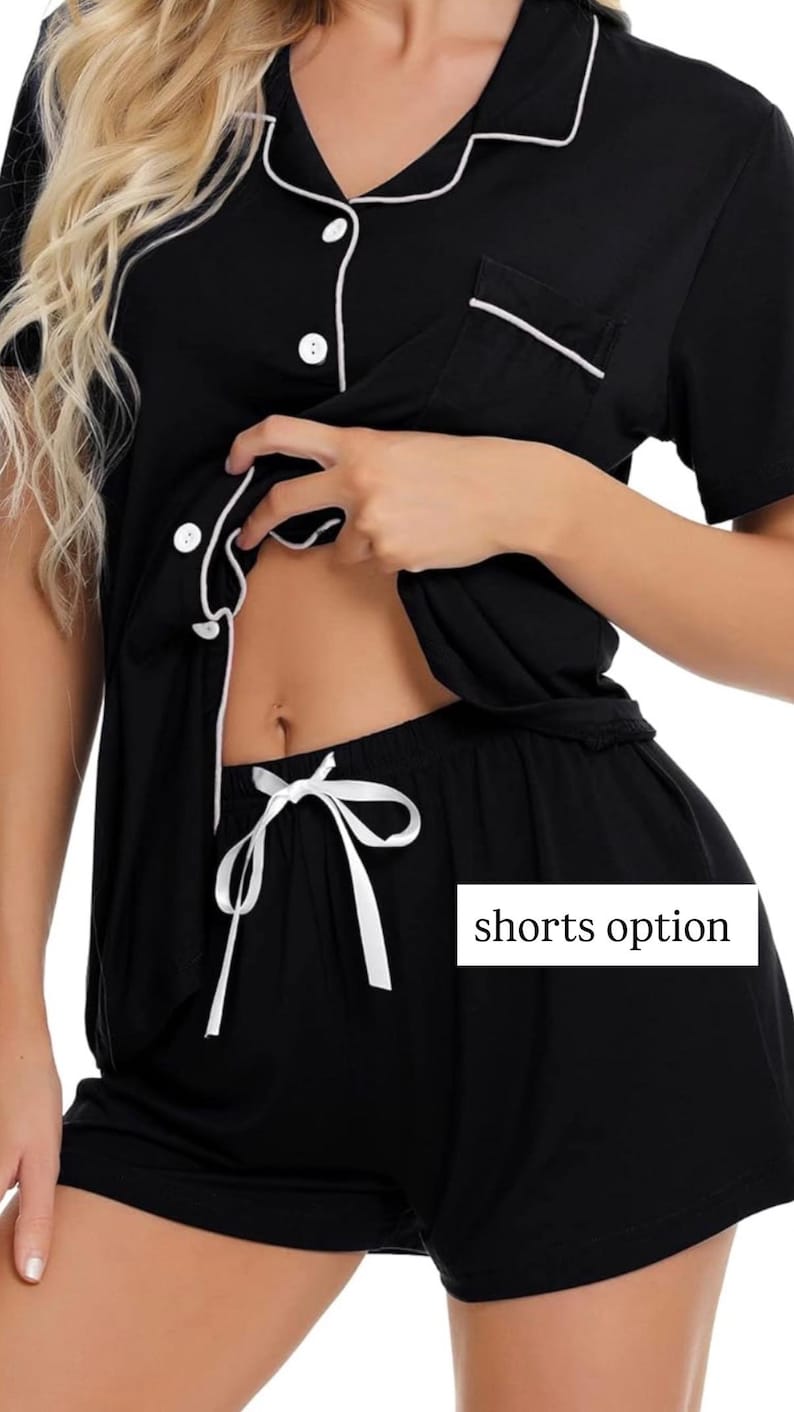 May include: Black pajama set with white trim and buttons. The shorts have a white drawstring. The text "shorts option" is visible in a white box. The top has short sleeves and a chest pocket.