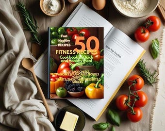 May include: A cookbook titled "50 Fitness Recipes" is open on a table, surrounded by ingredients like tomatoes, eggs, flour, and herbs. The cover features colorful images of healthy food. A wooden spoon and a small dish of butter are also present.